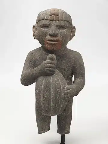 Statue of an Aztec Man Carrying a Cacao Pod
