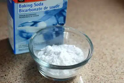 A box and a cup of baking soda