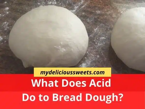 Two balls of bread dough on a floured granite surface.