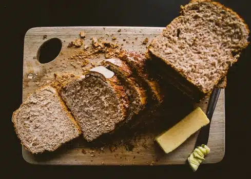 Whole wheat bread slices on a cuttig board