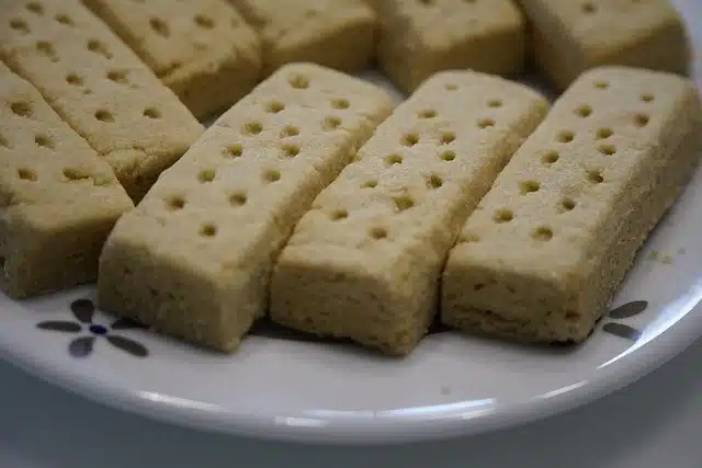 Shortbread fingers on a plate pricked on top.